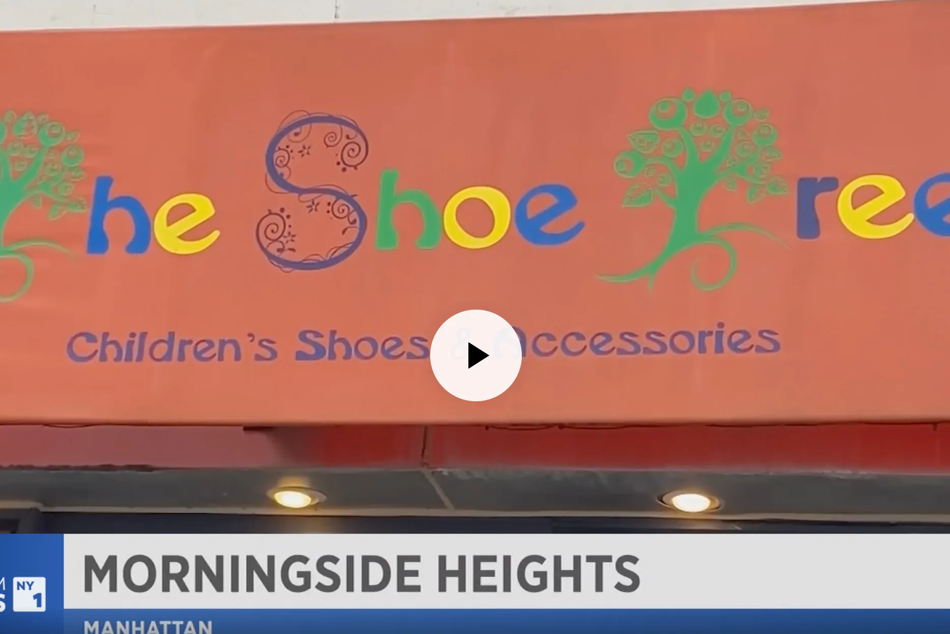 A video still that is paused at The Shoe Tree storefront.