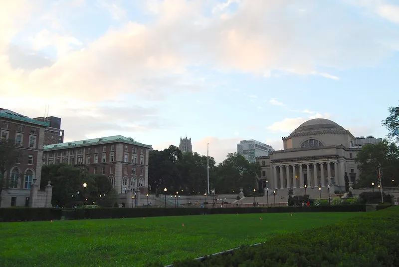 A view of the Morningside campus focused on Pulitzer, Dodge, and Low Library during dusk.